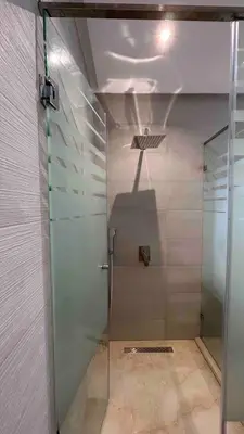 a shower with a glass door in a room at Private Villa with Pool in Marrakech