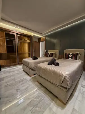 a hotel room with two beds in a room at Luxury Serenity Marrakech - Spacious Duplex with Pool in Marrakech
