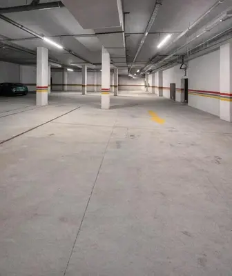 an empty parking garage with a car parked in it at Luxury Serenity Marrakech - Spacious Duplex with Pool in Marrakech