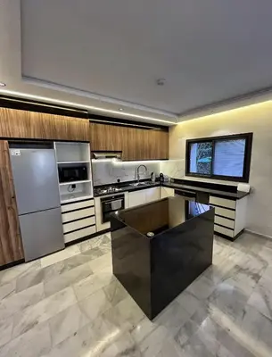 a large kitchen with stainless steel appliances at Luxury Serenity Marrakech - Spacious Duplex with Pool in Marrakech