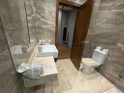 a bathroom with a toilet and a sink at Villa 5 in Marrakech