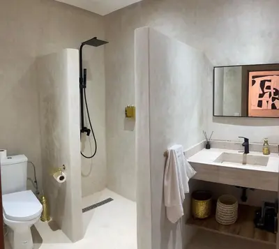 a bathroom with a toilet and a sink and a shower at Suite Dune - Confort et Elegance in Marrakech