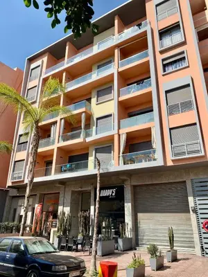 a building with a car parked in front of it at Small 1-bedroom apartment perfect for discovering Marrakech in Marrakech