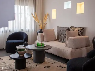 a living room with a couch and two chairs and a table at Sublime 2 bedroom apartment in Marrakech in Marrakech