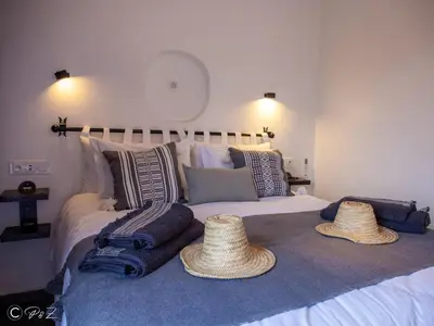 a bedroom with a bed with hats on it at Sublime 2 bedroom apartment in Marrakech in Marrakech