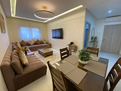 a living room with a couch and a table at Very nice apartment on Route de Casa in Marrakech