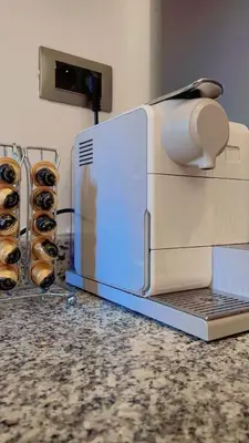 a toaster oven sitting on a counter next to some donuts at Prestihia jade in Marrakech
