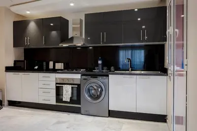 a kitchen with a washing machine and a sink at L'ambiance de Marrakech Luxe in Marrakech