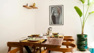 a dining room table with a tea kettle on it at Riad Reflet D'orient Marrakech in Marrakech