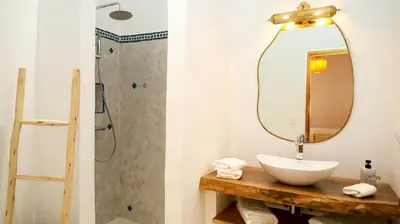 a bathroom with a sink and a mirror at Riad Reflet D'orient Marrakech in Marrakech