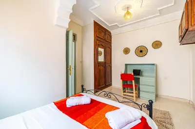 a bedroom with a bed and a fireplace at 2BR Medina Home with Roof Terrace in Marrakech