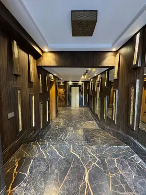 a hallway in a building with a marble floor at Luxury Retreat 2Bdr Appartment In Prime Marrakech in Marrakech