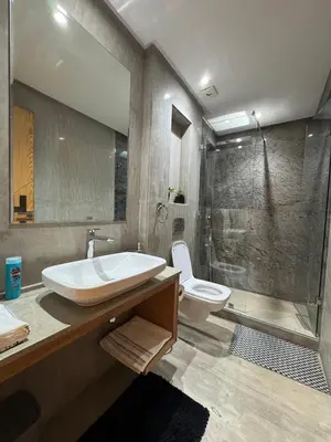 a bathroom with a sink and a toilet and a shower at Luxury Retreat 2Bdr Appartment In Prime Marrakech in Marrakech