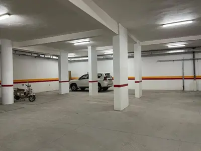 an empty parking garage with cars parked in it at Luxury Retreat 2Bdr Appartment In Prime Marrakech in Marrakech