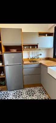 a kitchen with white cabinets and a counter top at Rouge Mamounia in Marrakech