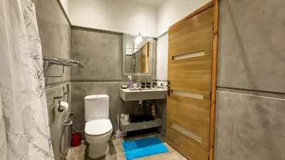 a bathroom with a toilet and a sink at Apartment near the airport in Marrakech