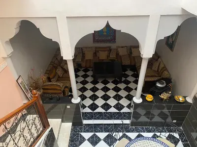 an overhead view of a living room with a tiled floor at Riyad jennah in Marrakech