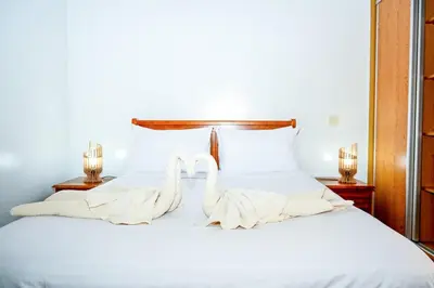 two swans towels are sitting on a bed at Luxury Odyssey Private Pool in Marrakech