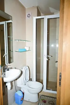 a bathroom with a toilet and a sink and a shower at Luxury Odyssey Private Pool in Marrakech