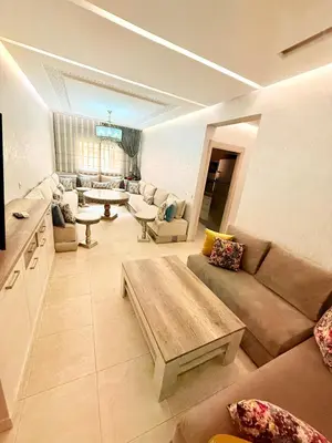 a living room with a couch and a table at Luxueux Aprt A Gat Moderne Centre-ville in Marrakech