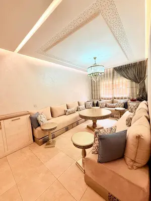 a living room with a couch and a table at Luxueux Aprt A Gat Moderne Centre-ville in Marrakech