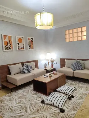 a living room with two couches and a coffee table at Eden Orientale in Marrakech