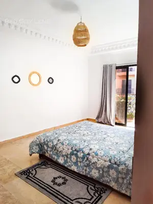 a bedroom with a bed and a window at Eden Orientale in Marrakech