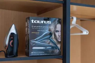 a box of tweezers and a hair dryer on a shelf at Modern & Chic Apartment in Gueliz, Marrakech in Marrakech