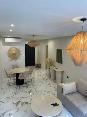 a living room with a couch and a table at Palmeraie Gates in Marrakech