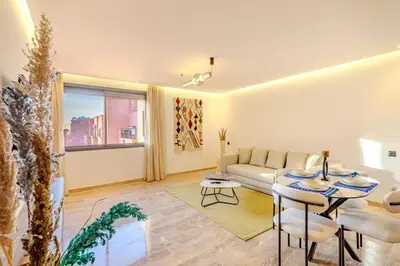 a living room with a couch and a table at 1BR appt in the centre gueliz in Marrakech