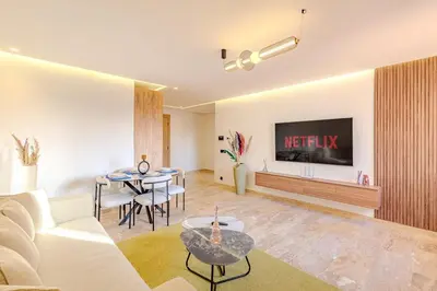 a living room with a couch and a table at 1BR appt in the centre gueliz in Marrakech