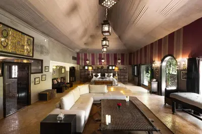 a large living room with a couch and a bed at PL Place Boutique Hôtel & Restaurant in Marrakech