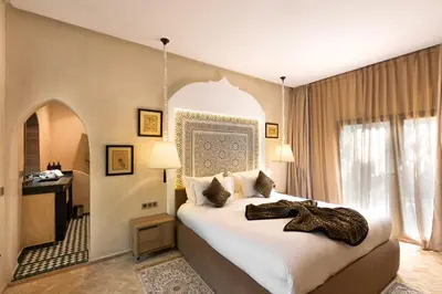 a bedroom with a large bed in a room at PL Place Boutique Hôtel & Restaurant in Marrakech