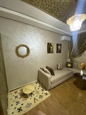 a living room with a couch and a table at Luxury Apartment Near Airport & Medina in Marrakech