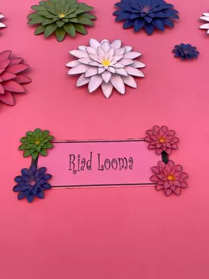a bunch of flowers on a pink background at Riad Looma in Marrakech