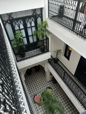 an overhead view of a balcony with potted plants at Riad Looma in Marrakech