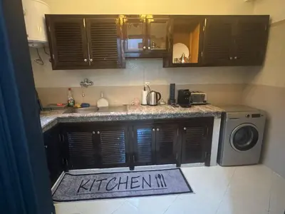a kitchen with a sink and a washing machine at Elegant Apartment in Marrakech Gueliz in Marrakech