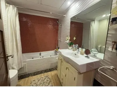 a bathroom with a sink and a tub and a toilet at Central Fiber Optic Pool in Marrakech