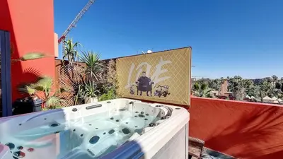a bath tub sitting on the side of a building at Exceptional View & Hot Tub Marrakesh in Marrakech