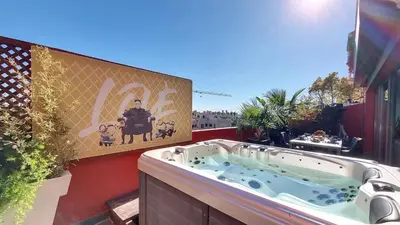 a jacuzzi tub on a balcony with a sign at Exceptional View & Hot Tub Marrakesh in Marrakech