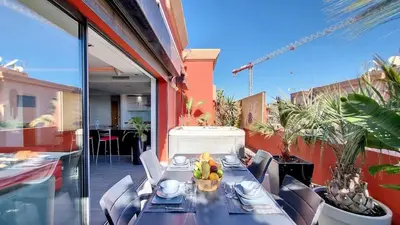 a table with a bowl of fruit on a balcony at Exceptional View & Hot Tub Marrakesh in Marrakech