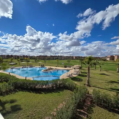 an image of a pool in a park at Luxury Flat 2 Bedrooms Prestigia Golf City in Marrakech