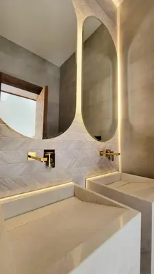 a bathroom with two sinks and a mirror at Modern Villa Selma in Marrakech