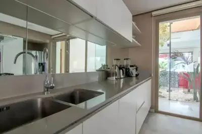 a kitchen with a sink and a large window at Spacious Villa with Mountain Views - 550 m² in Marrakech