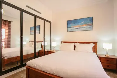 a bedroom with two beds and two lamps at Traditionnel Boutique - Marrakech Downtown in Marrakech