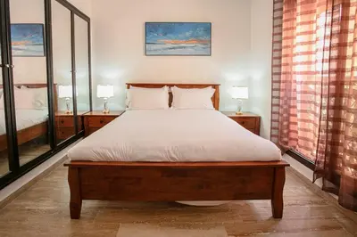 a bedroom with a large bed with two lamps at Traditionnel Boutique - Marrakech Downtown in Marrakech
