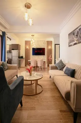 a living room with two couches and a table at Traditionnel Boutique - Marrakech Downtown in Marrakech