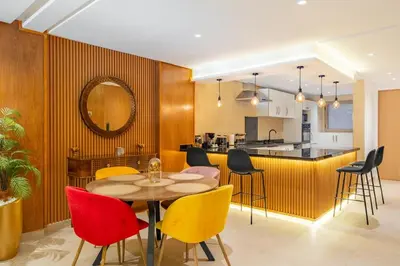 a dining room and kitchen with a table and chairs at M REVASION Elegant Luxury Stays in the Center of Marrakech in Marrakech