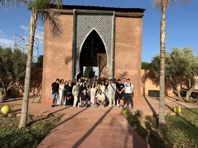 a group of people standing in front of a building at MSC Hostel in Marrakech