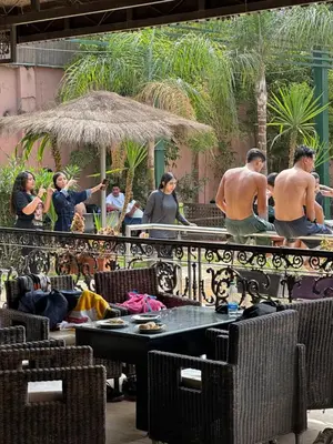 a group of people standing on a balcony at MSC Hostel in Marrakech